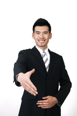 İş adamı el sıkışmak için elini uzatıyor.