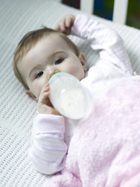 Baby Girl Lying Crib Drinking Milk — Stock Photo, Image