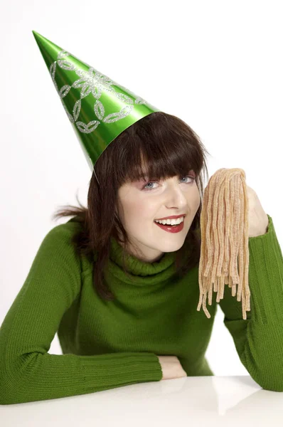 Woman Party Hat Holding Licorice — Stock Photo, Image