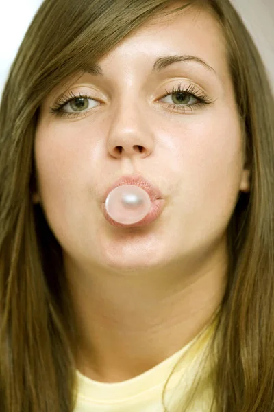 Girl blowing bubble gum