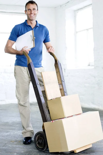 A delivery man preparing goods for delivery
