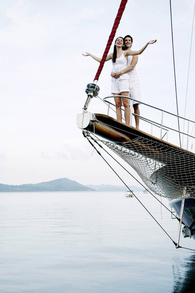 Couple cruising on a yacht