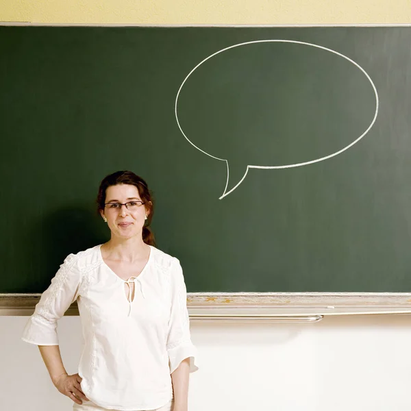 Woman with a speech bubble on the blackboard