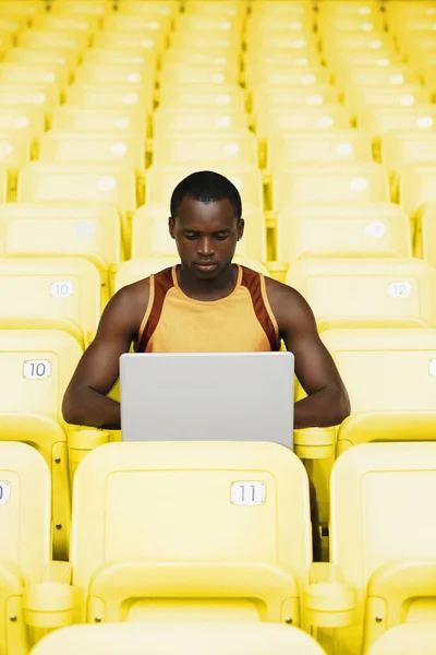 Man using laptop, front view