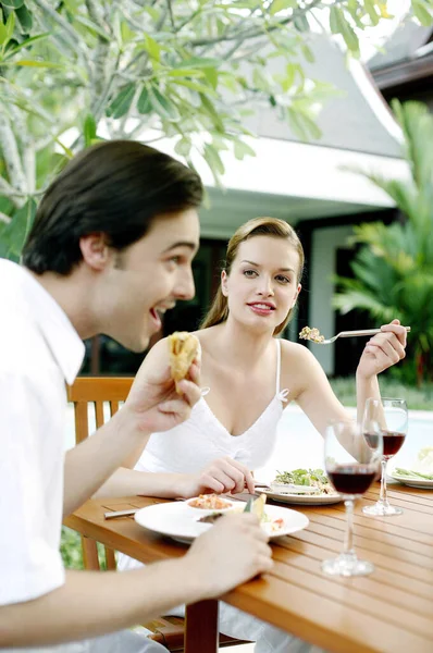 Couple having outdoor meal together