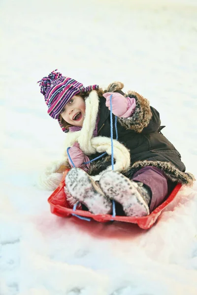 Girl Riding Sled — Stock Photo, Image