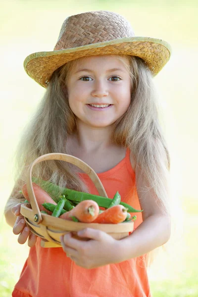 Girl Holding Basket Carrots Peas — Stock Photo, Image