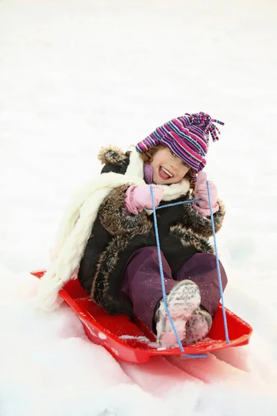 Girl Riding Sled — Stock Photo, Image