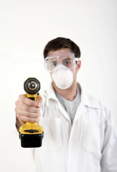 Construction Worker Taking Out Blueprint Tube Stock Photo by