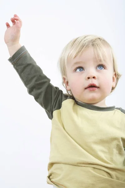 Preschooler Raising His Arm Stock Photo