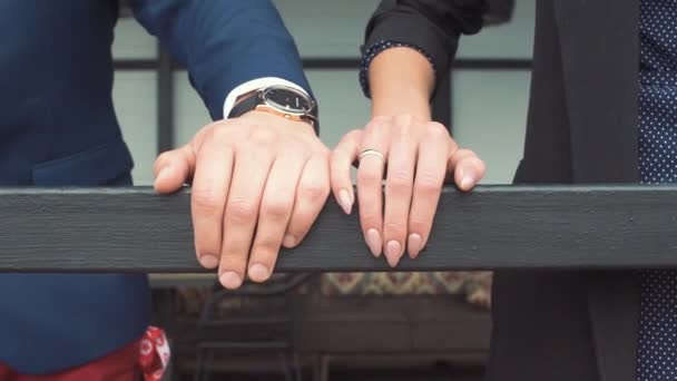 Young woman gently touches male hand. Romantic couple holding hands — Stock Video