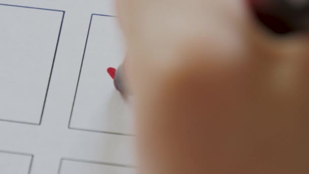 Woman draws a tick on voting blank. Close up hand writing a checkmark or vote — Stock Video