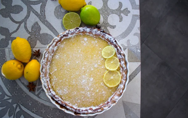 Lemon pie top view photo. Sweet pie with lemons. Close up photo of homemade dessert tart. Healthy eating concept.