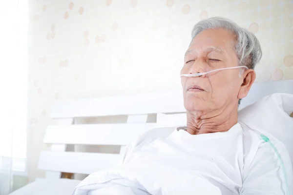 Elderly men with lung disease and respiratory illness lying in bed There is a risk of coronavirus infection. The concept of elder health care and prevention