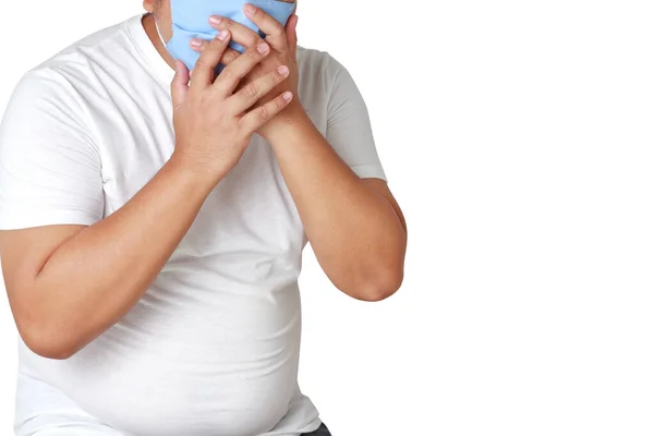 Asian fat man wears a blue cloth mask to cover his mouth and nose to protect against germs and the coronavirus. Because he has diabetes and is at risk of death. Health care concept, prevention.