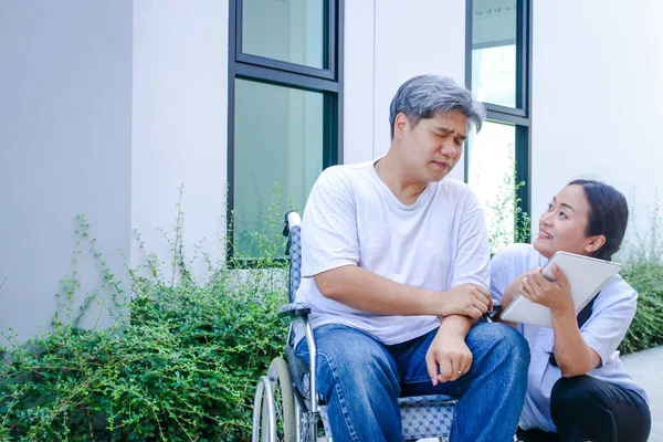 Girl Takes Care Male Patient Sitting Wheelchair She Wants Him — Stock Photo, Image