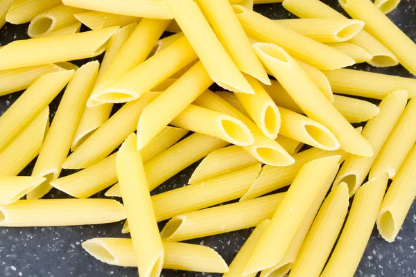 Pile Raw Pasta Penne Raw Cutting Board — Stock Photo, Image