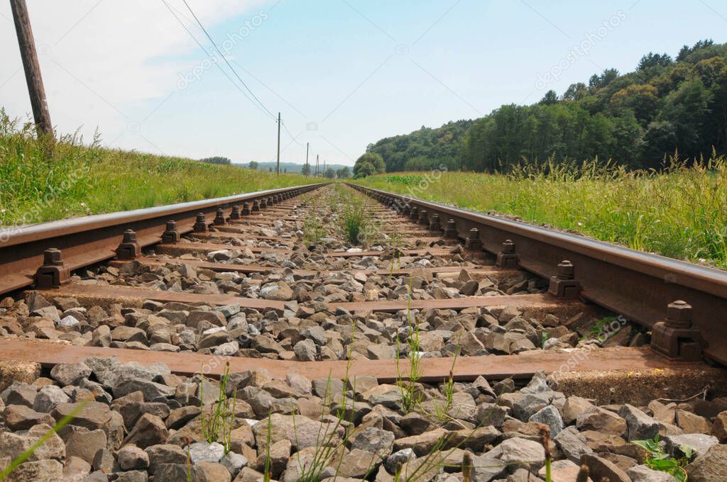 wooden sleepers for railway tracks, rail traffic infrastructure on a sunny day