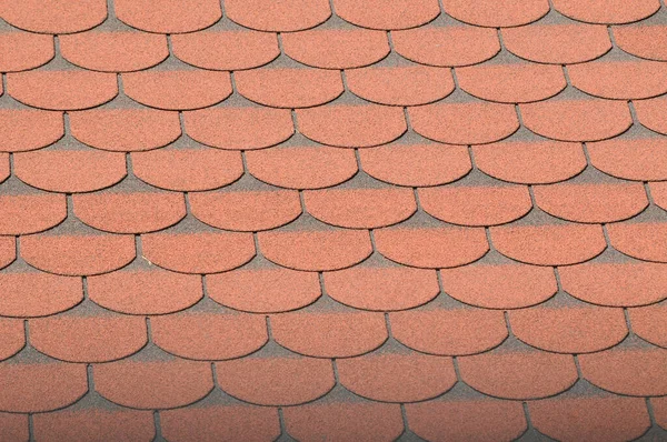 orange imitation tile roof on a house, texture and patterns