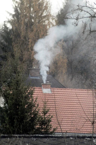 air pollution from house fire, smoke cloud in a village