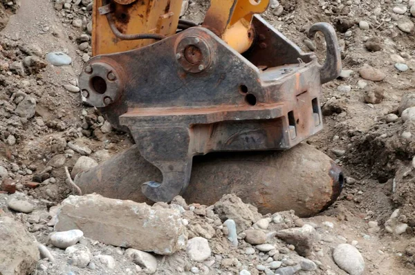 special machine grabs aerial bomb from the second world war, demining or mine clearance service