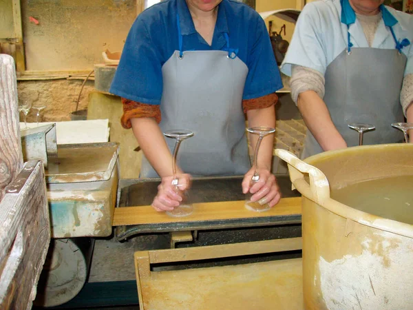 glass grinding with water at a glaziers workshop, handicraft business
