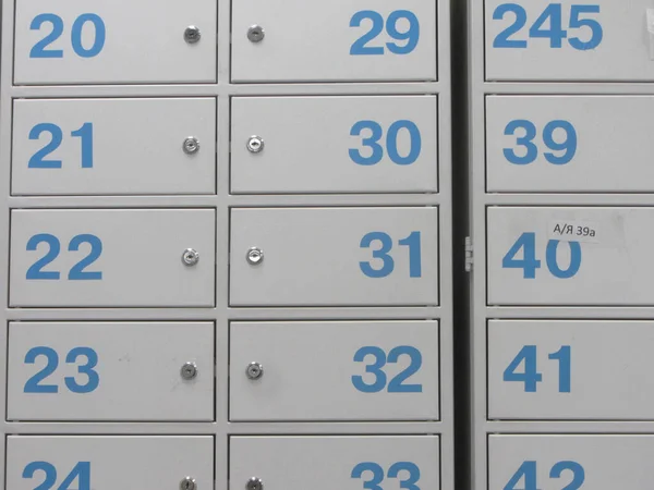safe deposit box or safe deposit locker, blue numbers on gray boxes