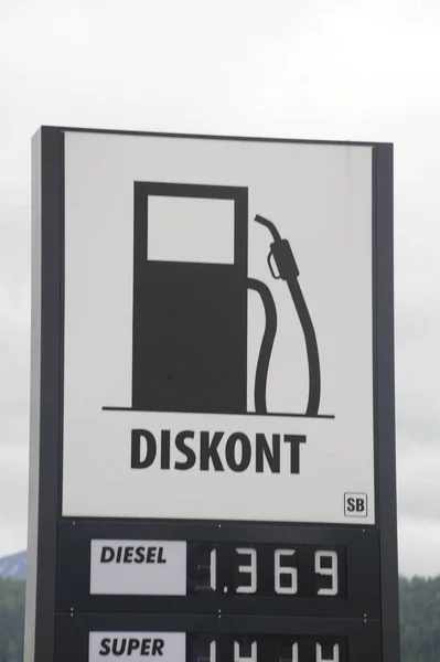 Diskont (Discount) petrol station sign, white sign, black pictogram and letters
