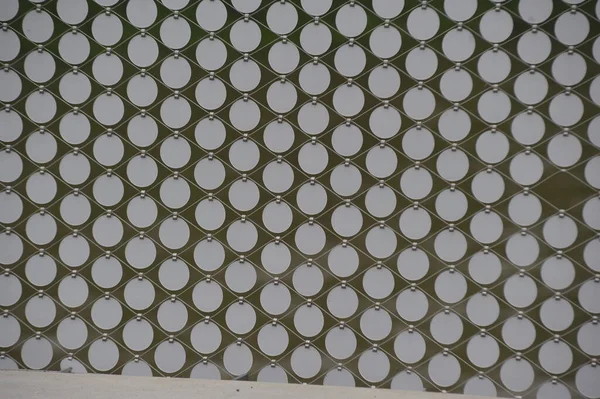 circle or round shaped object, pattern and texture on a surface