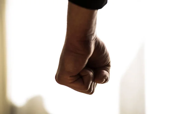 fist punch, an act of violence and aggression against others