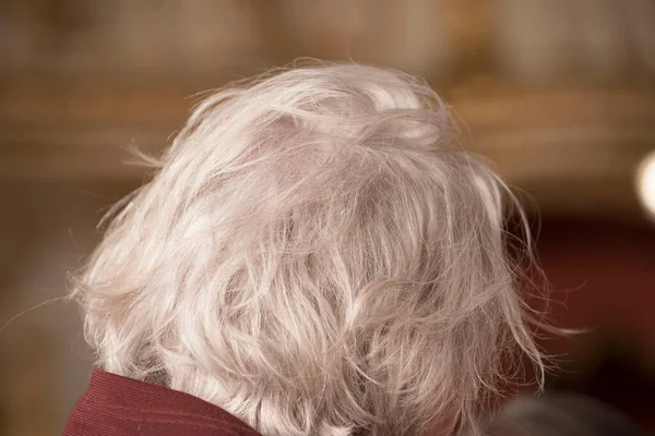 an older man with gray hair on the back of his head