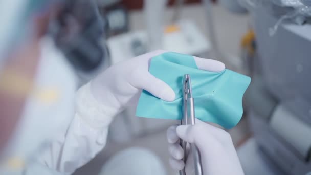 Close Dentist Hand Attentive Clipping Rubber Dam Preparing Operating Dental — Stock Video