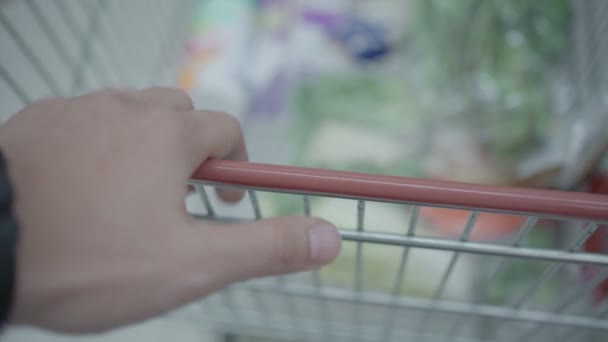 Close Asian Male Hand Handing Green Shopping Cart Trolley Grocery — стоковое видео