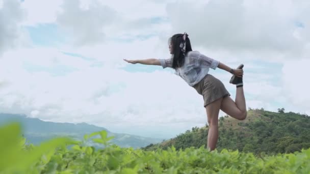 Asian Woman Wear Headphones Doing Yoga Mountains — Stock Video