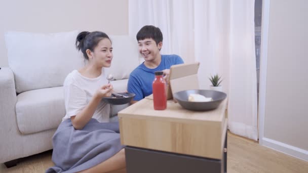 Happy Asian Couple Sitting Together Living Room Floor Watching Videos — Stock Video