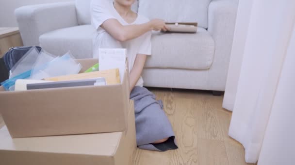 Wide Shot Female Buying New Apartment Take Stuff Out Parcel — Stock Video