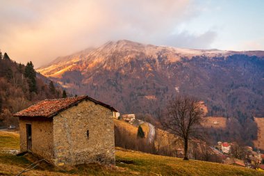 Beautiful view of the Orobie Alps at sunset,north Alps  autumn / winter, the mountain is a little snow-covered ,Oltre il Colle,Seriana Valley,Bergamo Italy. clipart
