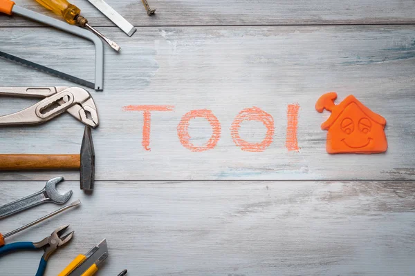 House icon and written "tool"  close up — Stock Photo, Image