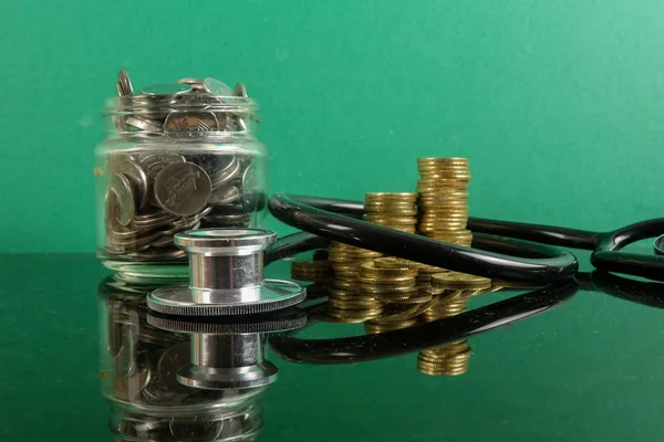 Medical Cost Concept Stethoscope Coins Green Background — Stock Photo, Image