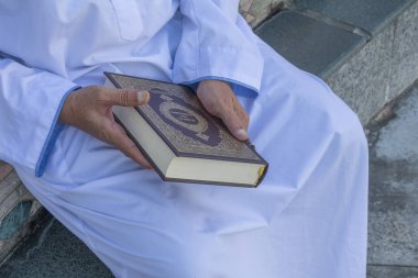 Middle age muslim man praying at mosque. clipart