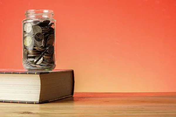 Education Fund Concept Coins Glass Jar Old Book — Stock Photo, Image