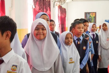 KUALA LUMPUR, 21 NOV 2018. Unidentified students and parents during year end prize giving caremony at primary school in Selangor, Malaysia. clipart