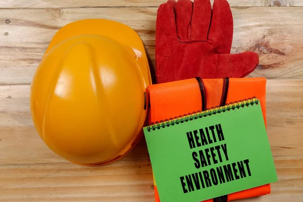 HEALTH,SAFETY & ENVIRONMENT CONCEPTUAL with general texts and standard construction safety equipment