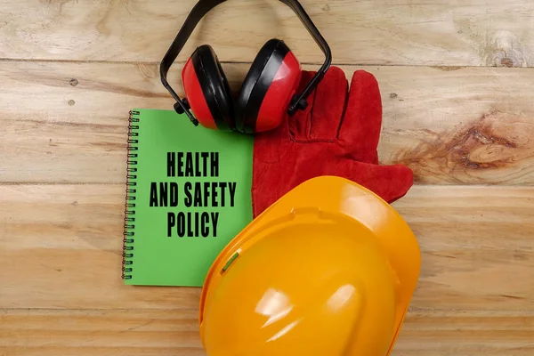 HEALTH,SAFETY & ENVIRONMENT CONCEPTUAL with general texts and standard construction safety equipment