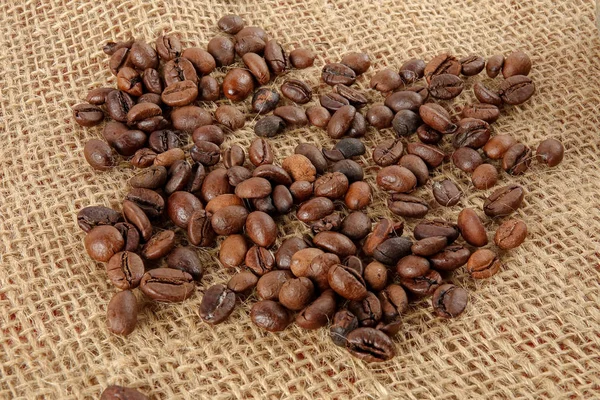 Kaffeebohnen Auf Einem Teppich Hintergrund — Stockfoto