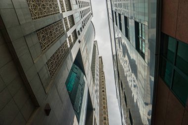 Modern glass skyscrapers perspective in the city clipart