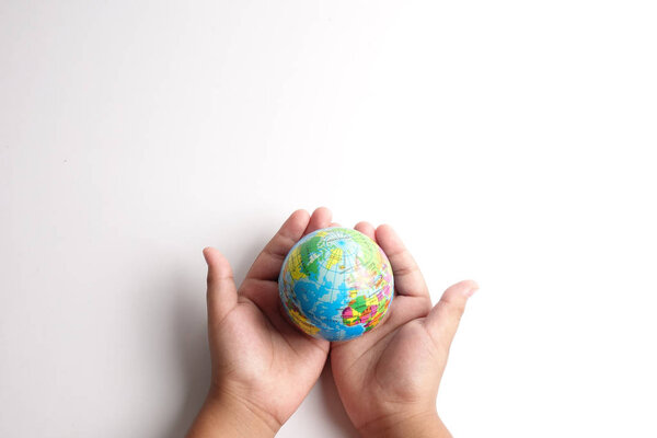 World globe  on a palm over a white. Globalization Concept