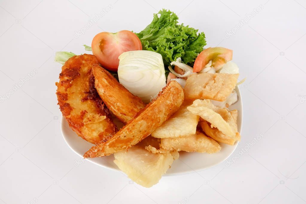 Fish and Chips with vegatables isolated on white.