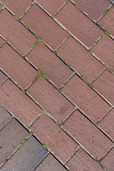 Dikdörtgen taş döşeme dokusu arka plan, kaldırımın seramik kaldırım levhaları, üst manzara. Dış yüzeyi asfaltlamak için inşaat malzemesi.