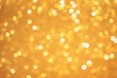 Bokeh odaklı ışıklarla güzel altın soyut arkaplan